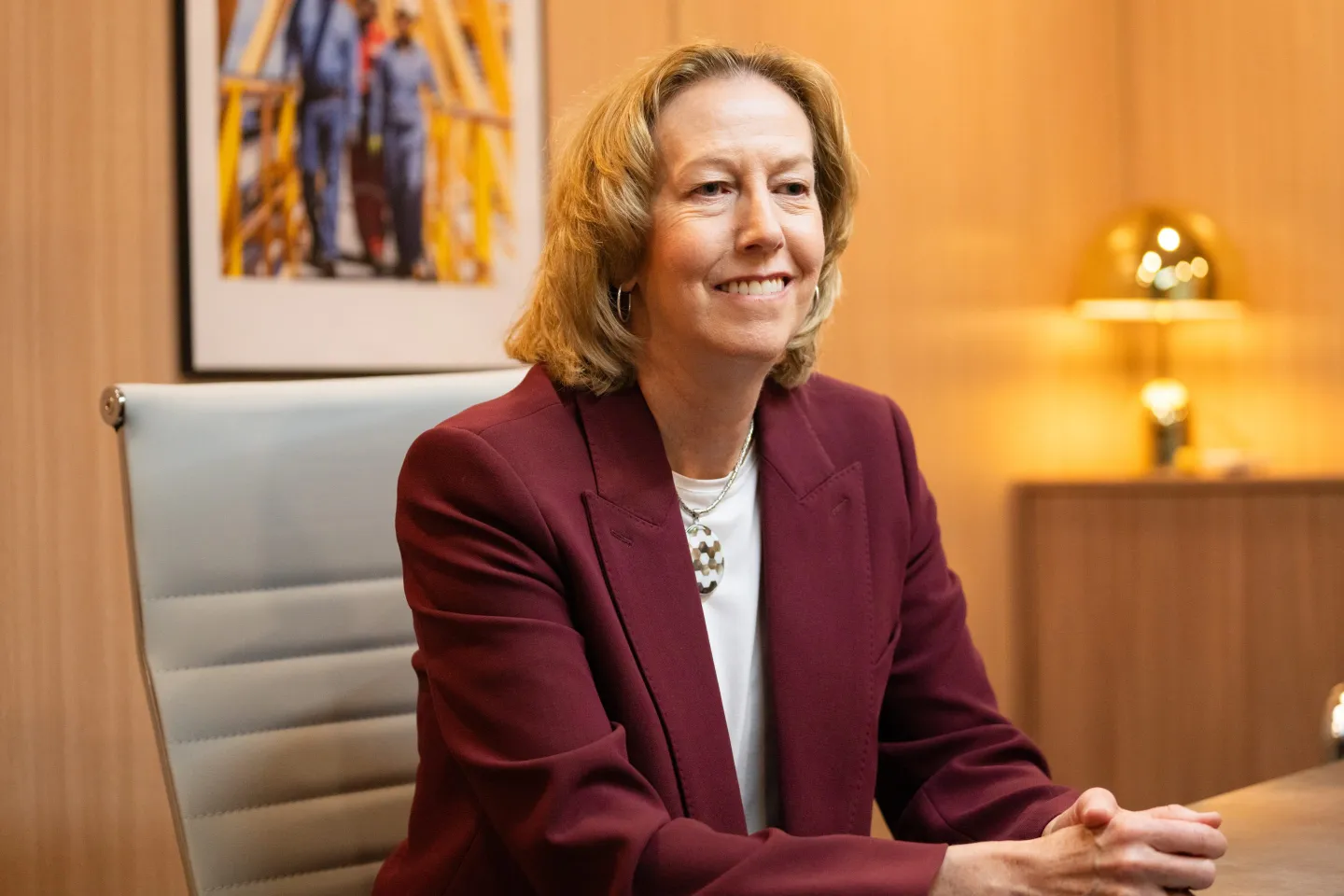 Woodside Energy CEO Meg O&#039;Neill speaks while seated on the sidelines of an energy conference.